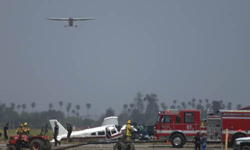 Warrior crash at Oxnard, with our Skylane departing in the background