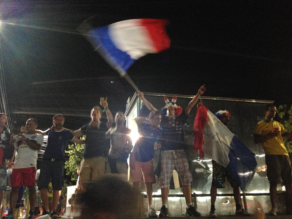 French fans celebrate their victory over Switzerland.  Or maybe it's a scene from Les Mis.  Who knows....